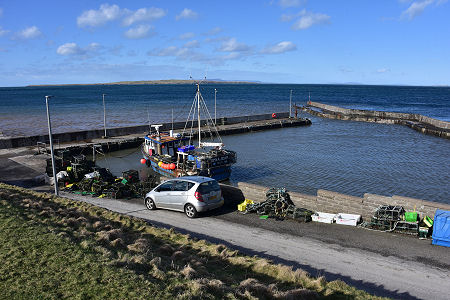 The Harbour at John o' Groats, with Orkney in the Distance