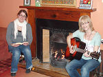 A sing-along by the fire in the Backpackers Lodge