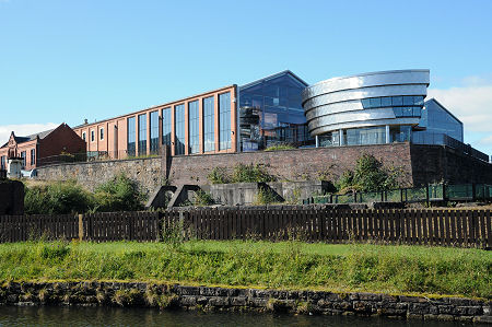 The Museum, with the Site of the Iron Works Below it, and the Canal in the Foreground