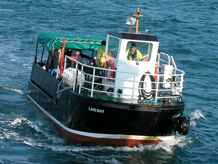 Laig Bay, the Eigg Flit Boat Approaching the Small Isles Ferry in 2003.  
				  The opening of a ferry slipway in Autumn 2004 meant that transfers to a flit boat were no longer needed. 
