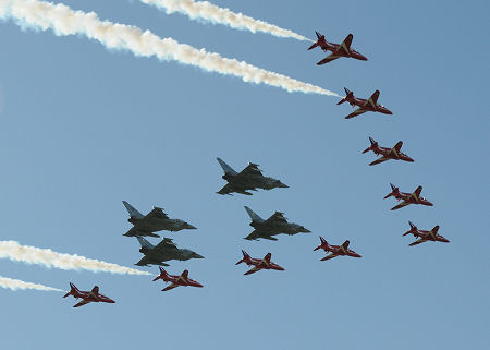 Red Arrows Arriving at the 2013 Airshow, Accompanied by Four Typhoons