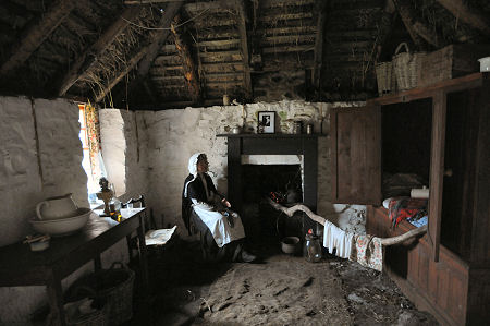 Recreated Cottage Interior, With Sheila Sitting by the Fire