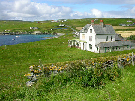 Houbie on Feltar, with Sir William Cheyne's retirement home,  Leagarth House, in the foreground
